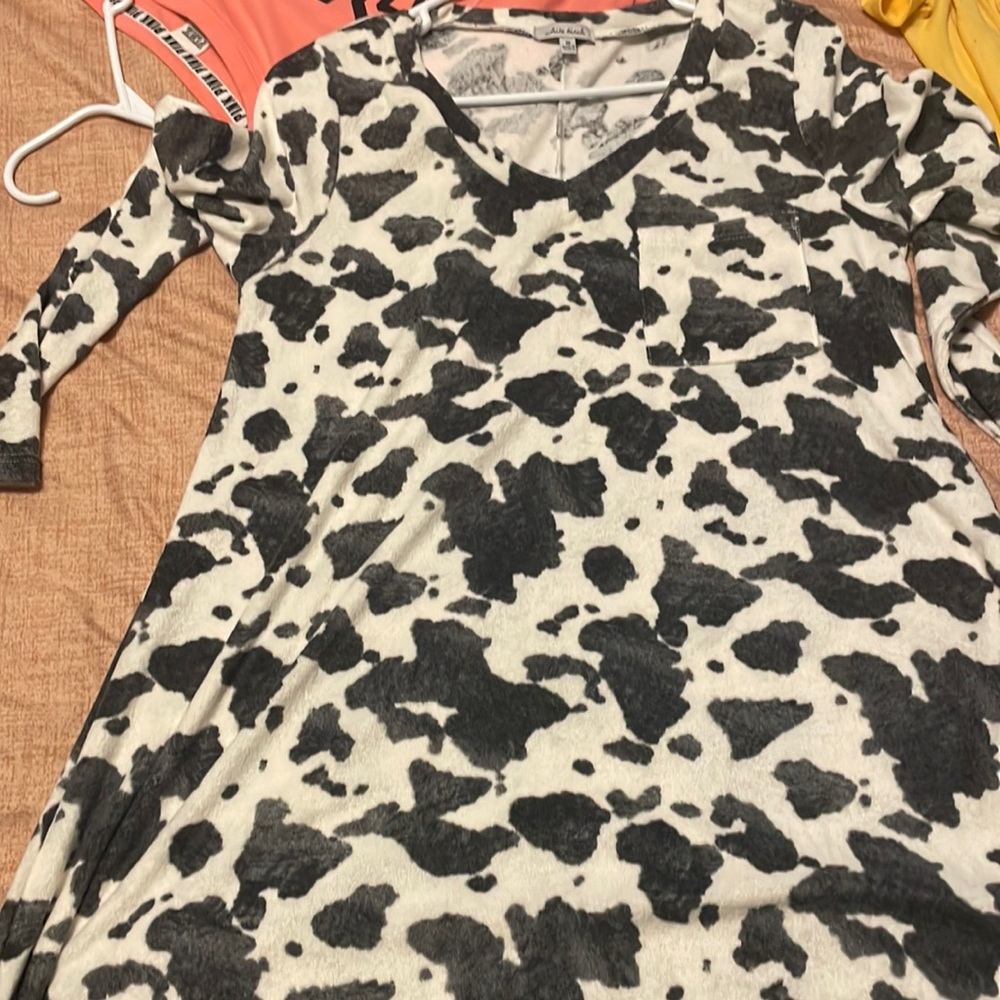 A short dress with a cow print on it